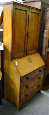 Lot 1349 - An oak bureau bookcase circa 1840