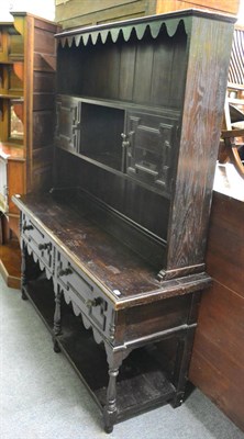 Lot 1351 - An oak dresser and rack