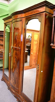 Lot 1357 - A mahogany triple wardrobe