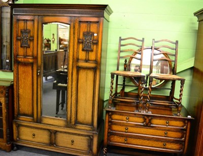 Lot 1360 - An oak mirror fronted wardrobe, oak dressing table and pair of oak rush seated chairs