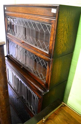 Lot 1363 - An oak four tier stacking bookcase