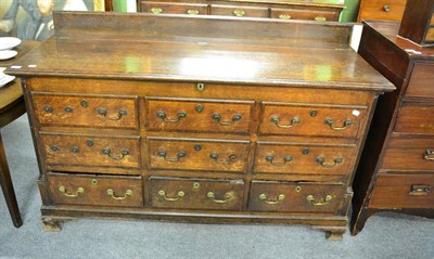 Lot 1368 - A George III oak mule chest