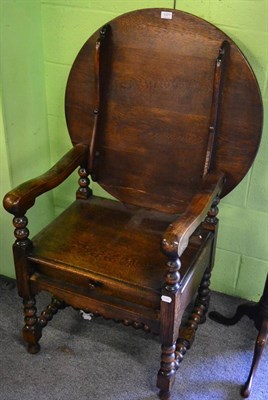 Lot 1371 - An oak monks chair