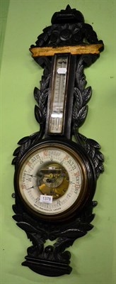 Lot 1378 - A carved oak barometer, Owen Robinson Ltd, Leeds (a.f.)