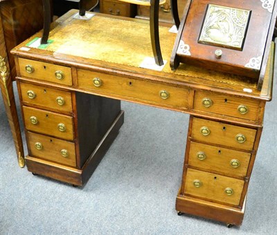 Lot 1382 - A 19th century double pedestal desk with leather top