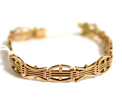 Lot 7 - A gold bracelet stamped 10ct, of fancy gate link form