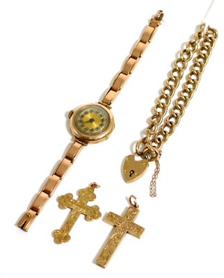 Lot 8 - A 9ct gold lady's wristwatch, a gold bracelet with padlock clasp and two gold cross pendants
