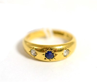 Lot 20 - An 18ct gold sapphire and diamond three stone ring