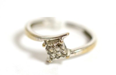 Lot 23 - A 9ct white gold diamond cluster ring, total estimated diamond weight 0.10 carat approximately,...