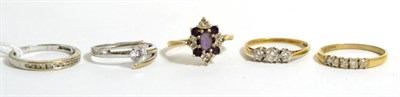 Lot 25 - A 9ct gold diamond half hoop ring (a.f.) and four 9ct gold cubic zirconia set rings (5)