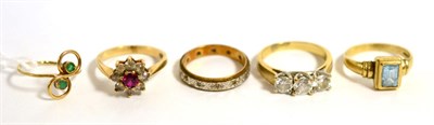 Lot 39 - A 9ct gold blue topaz ring, a 9ct gold emerald set ring, a 9ct gold diamond eternity ring and...