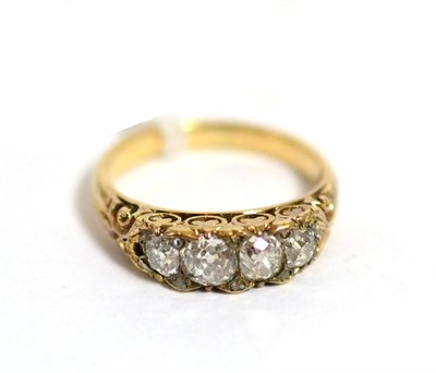 Lot 40 - A diamond ring, four graduated old cut diamonds spaced by rose cut diamond accents, in a yellow...