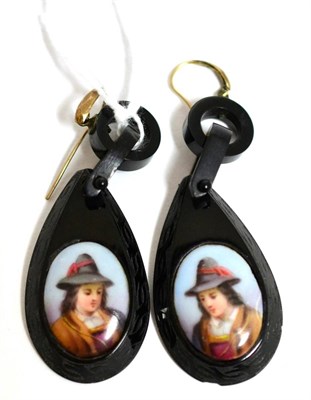 Lot 46 - A pair of jet earrings, each set with an oval portrait of a man to oval jet frames with carved...