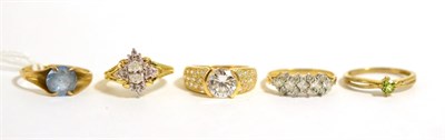 Lot 58 - A 9ct gold peridot ring, a 9ct gold blue topaz ring and three 9ct gold cubic zirconia rings (5)
