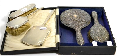 Lot 79 - A large silver backed mirror and brush, Birmingham 1919, cased; together with an Art Deco...