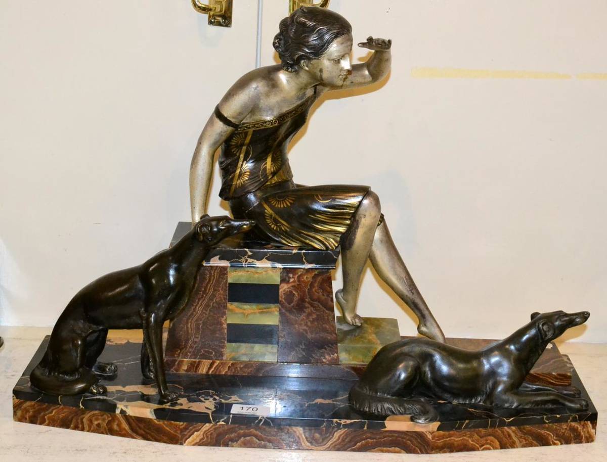 Lot 170 - An Art Deco group of a lady and a pair of Borzoi, the plinth signed Uriano