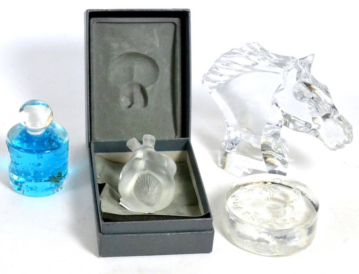 Lot 304 - A Lalique glass Nu Nabhi figure, boxed; with a Baccarat horse head and two other paperweights (4)