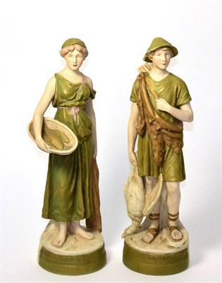 Lot 2 - A pair of Royal Dux figures in the neo-classical style, hunter and fisher woman, integral...