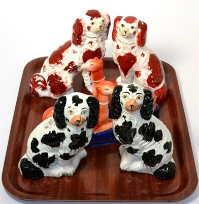 Lot 4 - Two pairs of Staffordshire pottery dog ornaments and a similar pair of greyhound inkwells (6)