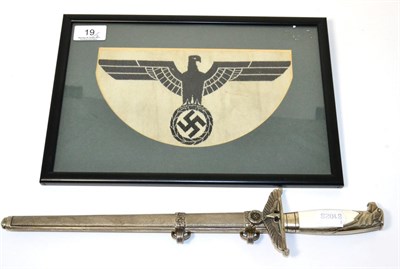 Lot 19 - A copy of a German Third Reich Diplomat's dagger; a German Third Reich Army sports vest emblem,...