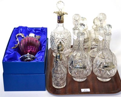 Lot 21 - Three pairs of cut glass decanters with silver wine labels, a silver collared decanter, two...