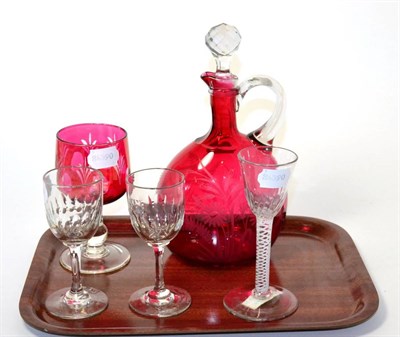 Lot 23 - A Victorian cranberry glass claret jug; similar stem goblet; 18th century opaque twist wine...
