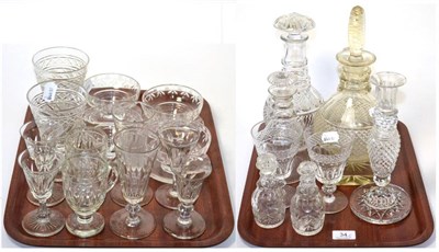 Lot 34 - Two trays of cut glass including decanters, drinking glasses, candlestick, sundae dishes etc
