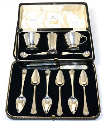 Lot 41 - A silver cruet set, retailed by Harrods (cased) and a set of six silver fruit spoons with a...