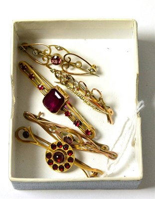 Lot 52 - Two garnet set bar brooches and three other bar brooches (5)