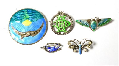 Lot 63 - A silver enamel circular brooch by FJM & Co and four other enamel brooches, including a scarab...