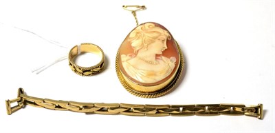 Lot 83 - A fancy band ring, a 9ct gold watch strap and a cameo brooch (3)