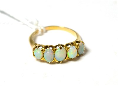 Lot 84 - A five stone opal ring