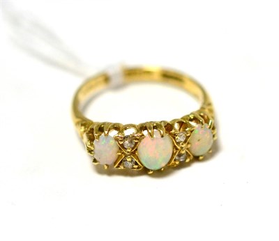 Lot 94 - An 18ct gold diamond and opal ring