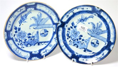 Lot 102 - A pair of 18th century Japanese blue and white porcelain plates (with paper labels for Fenton,...