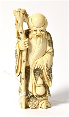 Lot 116 - An early 20th century okimono of a deity