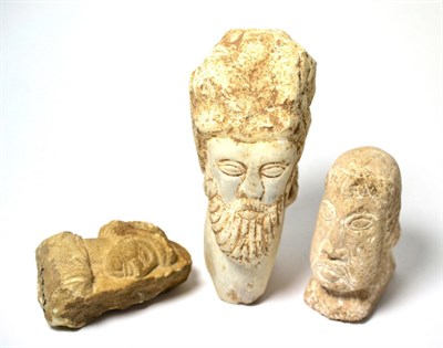 Lot 119 - Three stone heads