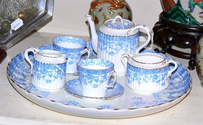 Lot 138 - A late Victorian china ";Elgin"; pattern breakfast set with circular tray and three items blue...