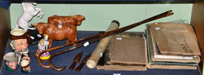 Lot 145 - A shelf of sundry including silver mounted walking sticks, scrap albums, pottery and two 19th...