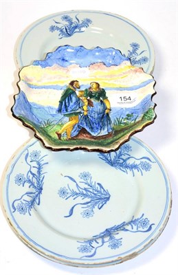 Lot 154 - A set of four 18th century tin glazed plates, painted with floral sprays and a 19th century tin...