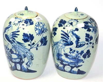 Lot 156 - A pair of early 20th century Chinese porcelain ovoid vases and covers