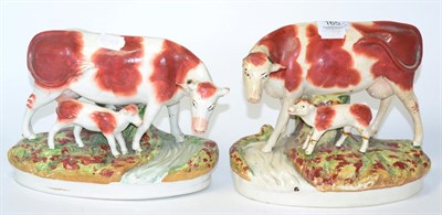 Lot 165 - A pair of 19th century Staffordshire pottery cow and calf ornaments