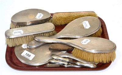 Lot 188 - A composite silver-backed brush and mirror set, various dates and makers with various manicure...