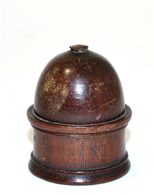 Lot 197 - A miniature globe in turned wood case