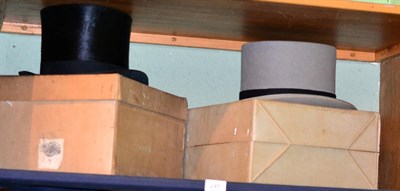 Lot 245 - A grey top hat by Moss Bros of Covent garden and another top hat by Tress & Co London