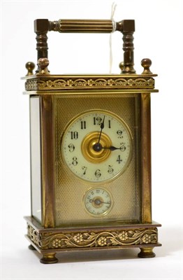 Lot 253 - A brass alarm carriage timepiece