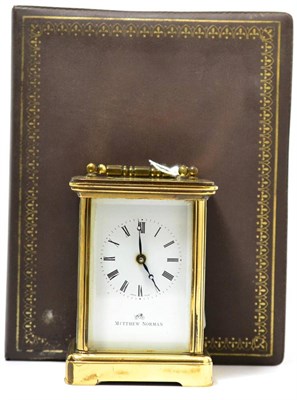 Lot 257 - A brass carriage timepiece, signed Matthew Norman, with outer box, instruction booklet and key