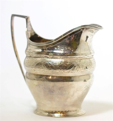 Lot 259 - A Georgian silver cream jug, London 1798