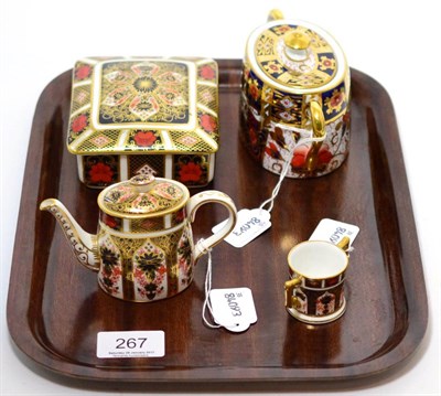 Lot 267 - Royal Crown Derby '1128' box and cover, miniature teapot and miniature two handled cup and an Imari