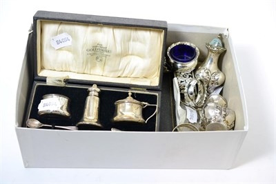 Lot 295 - Miscellaneous silver including a pair of pepperettes, M. Bros., Birmingham 1902; a cased cruet set