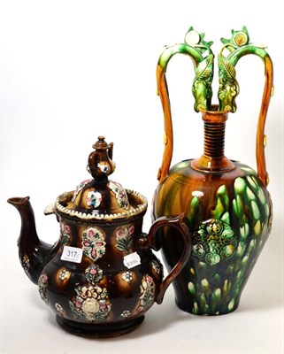 Lot 317 - Measham bargeware teapot decorated with thistles and a teapot finial, and a twin handled...